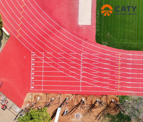 Pista atlética sintética asequible para todo tipo de condiciones meteorológicas, de bajo mantenimiento y resistente a los rayos UV